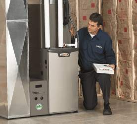 technician looking at hvac system