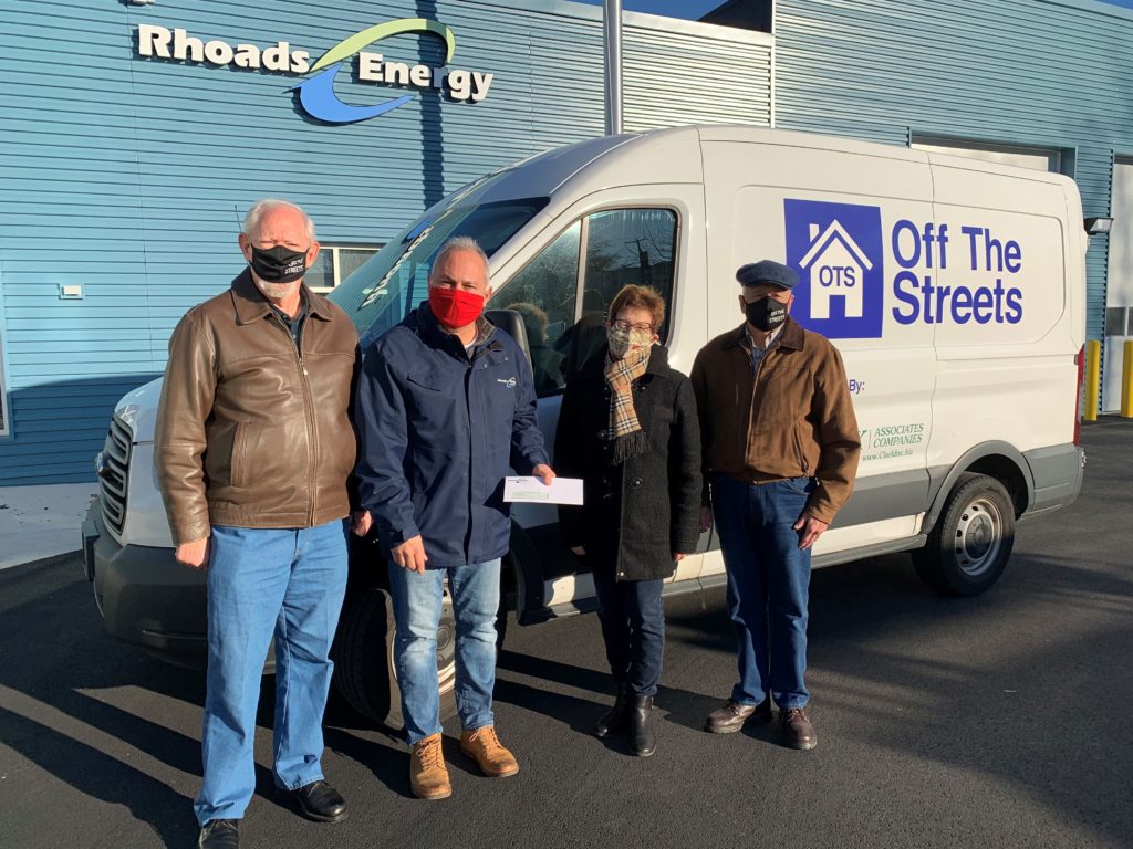 Four people standing in front of Off the Streets Van