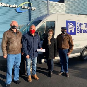 Four people standing in front of Off the Streets Van