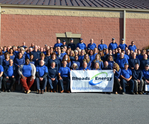 Group of employees with banner