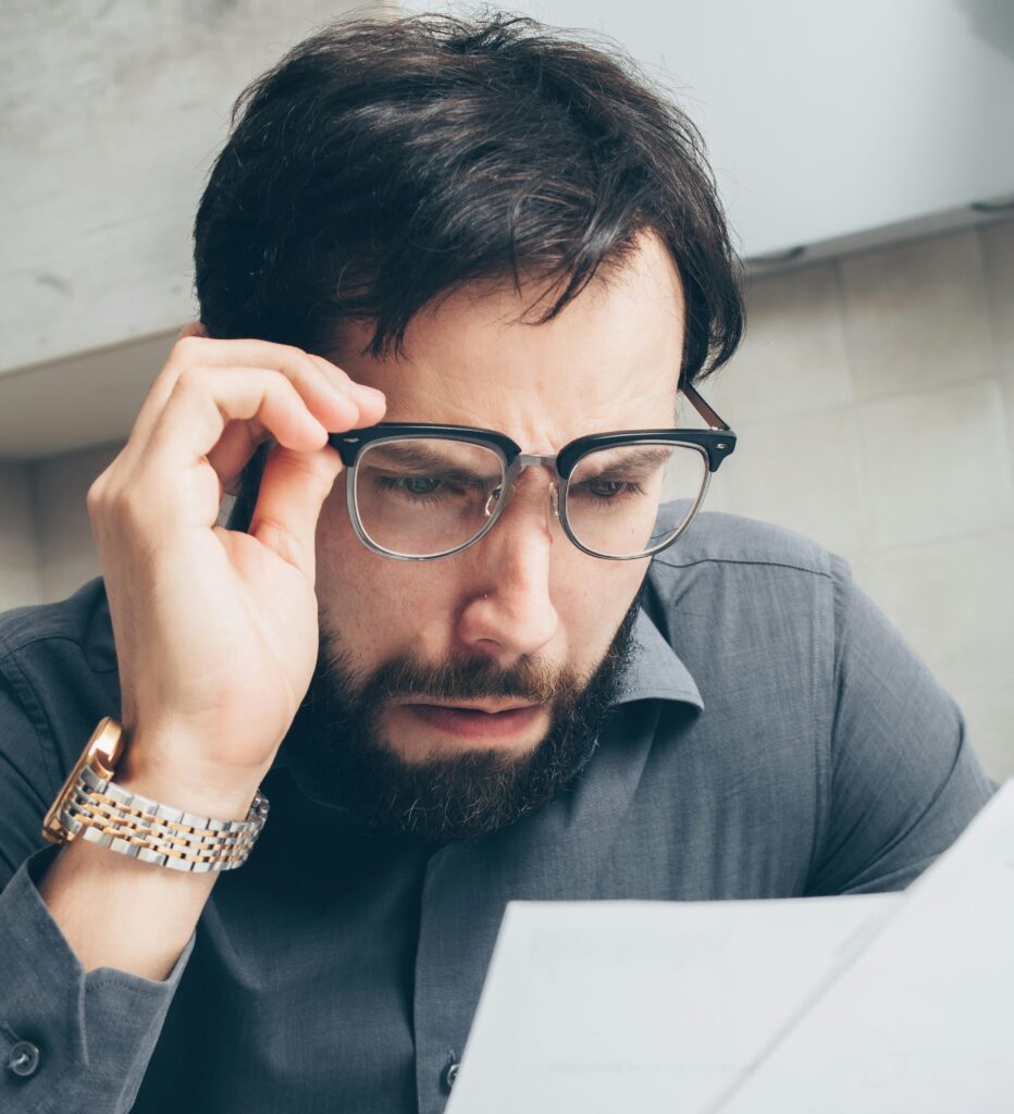 man studying his high electric bill